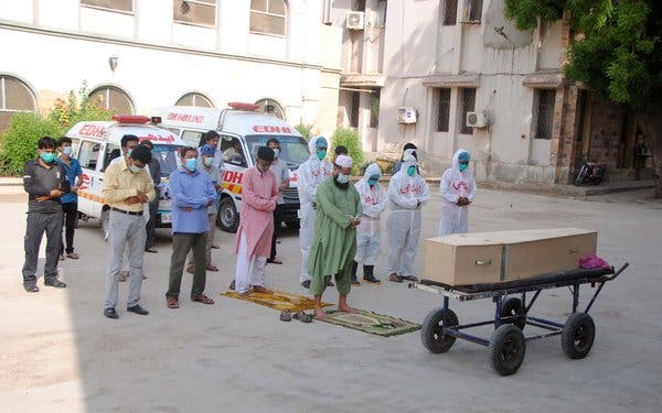 Funeral prayers for a person who died of Covid-19, in Hyderabad, Pakistan, last month.